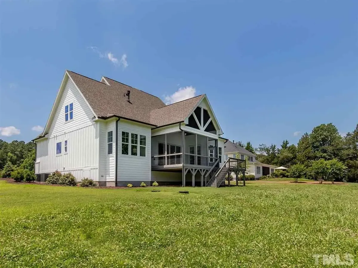 Actual Photos of House 9 – 1.5-Story House Plan 3912 ft²: 5 Beds, 4.5 Baths, Open Floor Plan, 3-Car Garage — 64220R